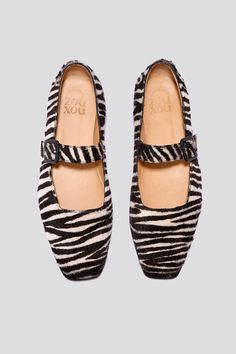 The Eugenia Flat is a modern interpretation of the classic mary jane flat featuring a square toe, angular topline and oval-shaped heel. This pair is crafted from zebra printed hair-on cow leather and a matching buckle. Who it’s for: The woman who is looking for mood-enhancing emotional pieces that defy reason, yet work perfectly with her style and sense of expression. Kidskin upper and undyed vegetable-tanned leather lining. Leather sole with stacked leather heel measuring 18mm. Handmade in Arge Fit Moodboard, Mary Jane Outfit, Loafer Mules, Mary Jane Flats, Flat Boots, Heeled Loafers, Boot Sandals, Vegetable Tanned Leather, Zebra Print