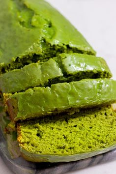 a loaf of green cake sitting on top of a counter