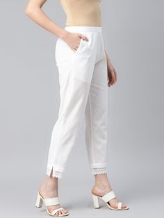 An amazing range of women's bottom wear in soft and solid colors that looks perfect for regular wear. With beautiful designs and patterns. These apparels are very stylish and comfortable too. Get rid of the 'regular' look this season wearing trouser by Piroh. With a perfect blend of comfort and style, This Straight Solid Pant from Piroh exhibits partially elasticated waistband, slits on hem with lace detail, 1 side pocket. Tailored from Cotton. Product Length: 39 Inches. Description  Size - Measuring Unit     : Regular Size                                   :  ( S, M, L, XL, XXL )  Fit                                      :Regular Fit Key Features                   :  Regular Fit::Women Trouser::Pure Cotton::White::Solid::Casual                                                Trousers::West Plain Wide Leg Cotton Bottoms, Plain Cotton Wide Leg Bottoms, Plain Cotton Wide-leg Bottoms, Solid Plain Long Bottoms, Solid Plain Ankle-length Pants, Relaxed Fit Plain Straight Bottoms, Solid Cotton Capris For Work, Cotton Capris With Elastic Waistband, Solid Color Cotton Trousers