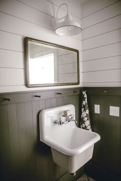 modern farmhouse bathroom with white porcelain wall sconce from Barn Light Electric Barn Light Electric, Vintage Tub, Cabin Bathrooms, Barn Light, Downstairs Bathroom, Basement Bathroom, Upstairs Bathrooms, Basement Renovations