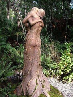 there is a statue in the woods with moss growing on it's back end