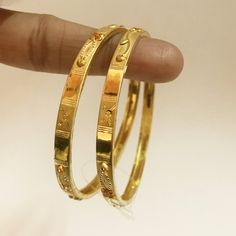 "Please contact us for any discounts or offers that are available on this item. All Sizes available. As these gold bangles are very light in weight, after making these bangles, we put a protective metal bangle on the inner surface of the original gold bangles, as shown in the 4th image, this provides strength & shape to the bangles. Please Note:- The bangles are made out of Real Solid Gold & the metal bangles are just for support & durability. We take absolute care of precious jewels 10 Grams Gold Bangles, Solid Bangles Gold, Round Bracelets For Diwali Celebration, Handmade Bracelets For Marriage And Festivals, Heavy Adjustable Bangle, Adjustable Heavy Round Bangle, Adjustable Round Bangle For Diwali, Handmade Bangle For Wedding And Festivals, Adjustable Bangle For Diwali