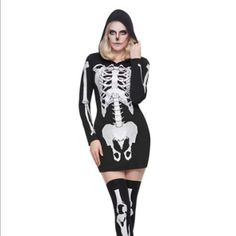 a woman in a skeleton costume posing for the camera with her hands on her hips