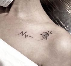 a woman's chest with a rose and the word mom tattooed on her left side