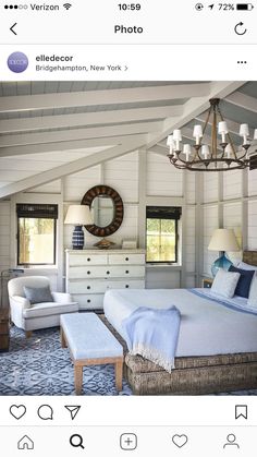 an instagram photo of a bedroom with white furniture and blue accents on the walls