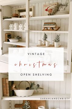 an open shelving unit with christmas decorations on top and the words vintage christmass written above it