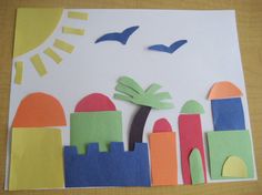 a paper city with palm trees and birds