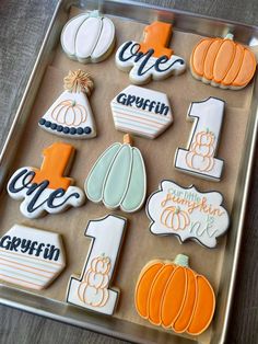 decorated cookies in the shape of numbers and pumpkins