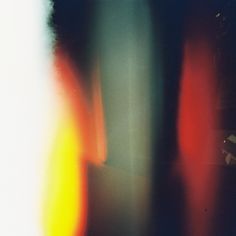 blurry photograph of an orange and yellow object