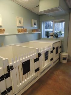 a dog kennel in the middle of a room