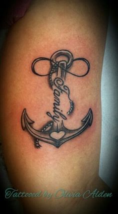 a black and white photo of an anchor tattoo