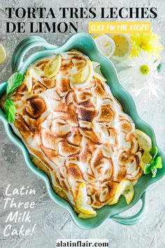 a dish with lemons and meringue on it, in a blue bowl