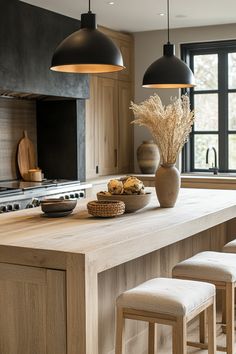 a large kitchen island with stools next to it