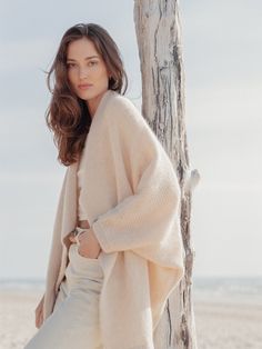 Elevate your ensemble with a handcrafted natural wool poncho cape, the epitome of comfort and coziness. This unbuttoned women's top exudes a summer holiday vibe, offering the perfect shoulder cover. Expertly hand-knitted and longer than your typical poncho, it boasts the finest alpaca wool and pure new merino wool yarns for an exceptionally soft feel. The Gift of Endless Comfort: Looking for the perfect gift? This handmade knit is a thoughtful gesture that shows you care. Surprise a loved one wi One Size Beige Wool Poncho, Beige Wool Poncho One Size, Cozy Beige Wool Poncho, Beige Wrap Poncho For Winter, Cozy Wool Poncho For Layering, Beige One Size Wool Outerwear, Cozy Oversized Cashmere Cape, Oversized Cozy Cashmere Cape, Wool Cape