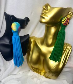 Add a pop of fun to your wardrobe with these handmade button and yarn tassel earrings! These lightweight, boho-chic earrings feature colorful yarn tassels hanging from vibrant buttons, creating a playful and unique accessory that's perfect for any occasion. Whether you're dressing up for a festival, or adding a quirky touch to your everyday look, these earrings will make a statement. Each pair is crafted with care, using high-quality materials to ensure comfort and durability. Express your individuality with these charming, one-of-a-kind earrings! Choose from our 7 variations.  Care Instructions: To keep your earrings looking their best, avoid contact with water and store them in a dry, safe place when not in use. Multicolor Fringe Tassel Earrings For The Beach, Bohemian Rainbow Tassel Earrings, Diy Yarn Earrings, Yarn Tassel Earrings, Yarn Jewelry, Yarn Earrings, Yarn Tassel, Diy Yarn, Tassel Earring