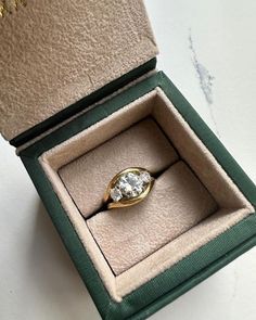 an open box with a ring in it