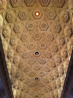 an ornate ceiling in the middle of a building