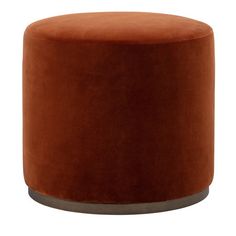 an orange velvet stool with metal legs and round foot rests on a white background,