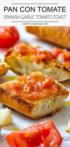 two pieces of bread with tomatoes and cheese on top, next to some other food