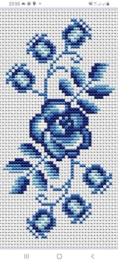 a cross stitch pattern with blue flowers on it