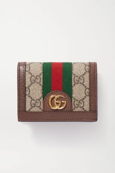 As classic Gucci as you can get, this 'Ophidia' wallet has been made in Italy from monogrammed coated-canvas detailed with striped webbing and a logo plaque. Traced with textured-leather, it has a snap-fastening flap and plenty of room inside. Dompet Gucci, Gucci Wallet Women, Gucci Bags Handbags, Cowhide Clutch, Luxury Wallets, Wallets For Girls, Gucci Ophidia, Stylish Purse, Canvas Wallet