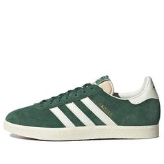 The Adidas Gazelle 'Faded Archive' is a timeless classic. Drawing inspiration from the 60s and 70s, this sneaker is perfect for those looking for a stylish, yet comfortable shoe. Crafted with a green leather upper and white accents, this shoe is sure to stand out. The iconic T-toe design and signature 3-stripes provide a classic look, while the cushioning midsole ensures comfort. Whether you're a football fan, skater, or rocker, the Adidas Gazelle 'Faded Archive' is the perfect shoe for any acti Classic Adidas Sneakers With Rubber Sole, Classic Adidas High-top Sneakers With Rubber Sole, Classic Adidas Sneakers With Vulcanized Sole, Classic Green Sneakers With Gum Sole, Classic Green Sneakers With Vulcanized Sole, Vintage Lace-up Sneakers With Cushioned Footbed, Classic Adidas Lace-up High-top Sneakers, Vintage Sneakers With Rubber Waffle Outsoles And White Sole, Vintage Sneakers With White Sole And Rubber Waffle Outsoles