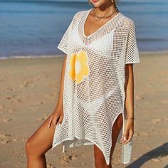 Women Casual Bikini Swimsuit Cover-Up Blouses Beach Tunic Dress One Size K529 Acrylic + cotton blend Imported Hand Wash Only The fabric has some stretch Feature: long sleeve, hollow out, crochet cover up, cover ups for swimwear women Regular fit, swim cover-ups for women, crochet cover-ups for swimwear women, swimsuit cover-up Occasions: suitable for swimwear, beach, swimming pool, summer party, and vacation Please refer to the last image for the size chart (The size chart is clothes size, NOT h Fitted V-neck Beach Cover-up, V-neck Stretch Swimwear For Beach, Stretch V-neck Swimwear For The Beach, Fitted Short Sleeve Cover-up For Vacation, White Summer Swimming Cover-up, Stretch V-neck Swim Dress For Vacation, Summer V-neck Swimwear For Beach Season, V-neck Cover-up For Sunbathing, Summer Stretch V-neck Swim Dress