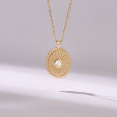 Introducing our elegant Oval Shape Sunbeam Necklace, meticulously crafted from 14k solid yellow gold. This minimalist pendant features a sleek oval shape adorned with a dazzling bezel-set real diamond, adding a touch of sophistication to any ensemble. The sunbeam motif exudes warmth and radiance, making it the perfect accessory to brighten up your look.  Features * Made to Order * Gold KT: 14KT * Custom Gold Color:  Yellow Gold * Charm 18.75x13.00 mm * Charm Thickness: 1.45 mm * Diamond Color-Clarity: D-E-F color VVS Clarity * Total CTW: 0.10 ctw * Ready to Ship in 5-7 Business Days ✓ We care about the environment,the jewelry we cast is made with recycled gold. We source exclusively post-consumer material that is refined back to their pure elements to ensure that the gold is in the same qu Luxury Oval Brass Necklace, Gold Oval Pendant Diamond Necklace, Minimalist Gold Diamond Necklace With Polished Finish, Gold Pendant Diamond Necklace With Bezel Setting, Gold Diamond Pendant Necklace With Bezel Setting, Yellow Gold Oval Pendant Necklace With Single Diamond, 14k Yellow Gold Oval Pendant Diamond Necklace, 14k Yellow Gold Diamond Necklace With Oval Pendant, Gold Oval Pendant Diamond Necklace For Anniversary