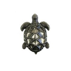 a silver turtle broochle on a white background