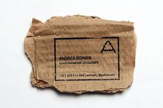 a piece of brown paper with a black and white business card on the bottom that says, anderson romani