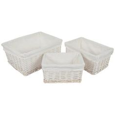 three white wicker baskets sitting next to each other