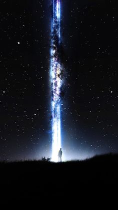 a man standing in the middle of a field under a star filled sky