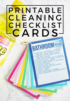 the printable cleaning checklist cards are laid out on a marble counter top with text overlay that says printable cleaning checklist cards