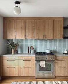 a kitchen with wooden cabinets and stainless steel appliances