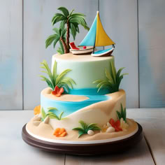 a colorful cake decorated with palm trees and boats on the beach, sitting on a wooden table