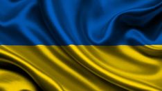 the national flag of ukraine is depicted in this close - up photo with silky folds