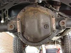 the rear end of a vehicle with an exhaust pipe and gasket on it