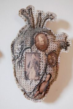 a piece of art that looks like a human heart with pictures on the front and sides