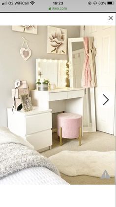 an image of a bedroom setting with white furniture and pink accessories on the dressers