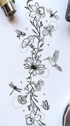 an ink drawing of flowers and birds on white paper with black marker pens next to it