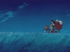 two people riding on a bike in the ocean