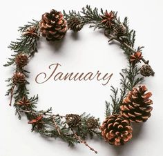 a pine cone wreath with the word january written in it