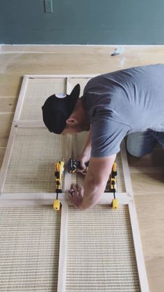 a man laying on the floor with tools