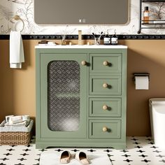 a bathroom with a sink, mirror and green cabinet in the middle of the floor