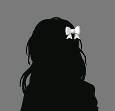 the silhouette of a girl with a bow in her hair, against a gray background