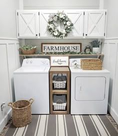 a white washer and dryer sitting next to each other in a laundry room