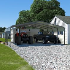 two trucks are parked in front of a garage with a tractor attached to the side