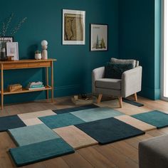 a living room with teal walls and wooden floors