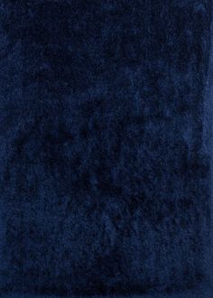 a dark blue area rug is shown in the middle of an image with no background