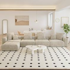 a living room filled with furniture and a white rug